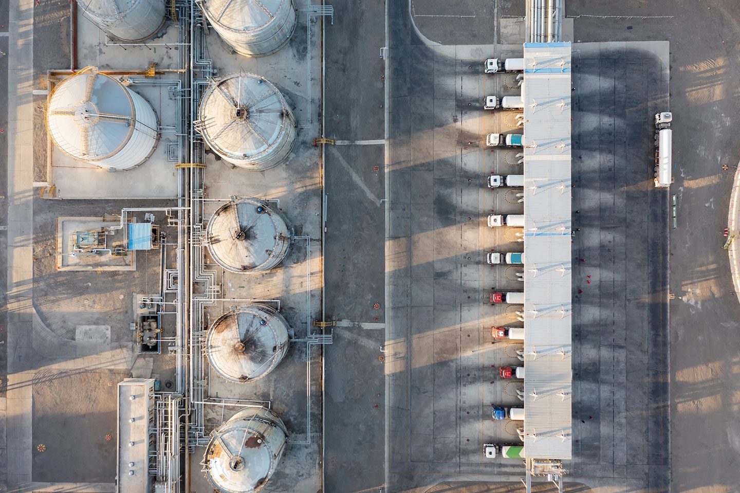 aerial view of an oil refinery and trucks